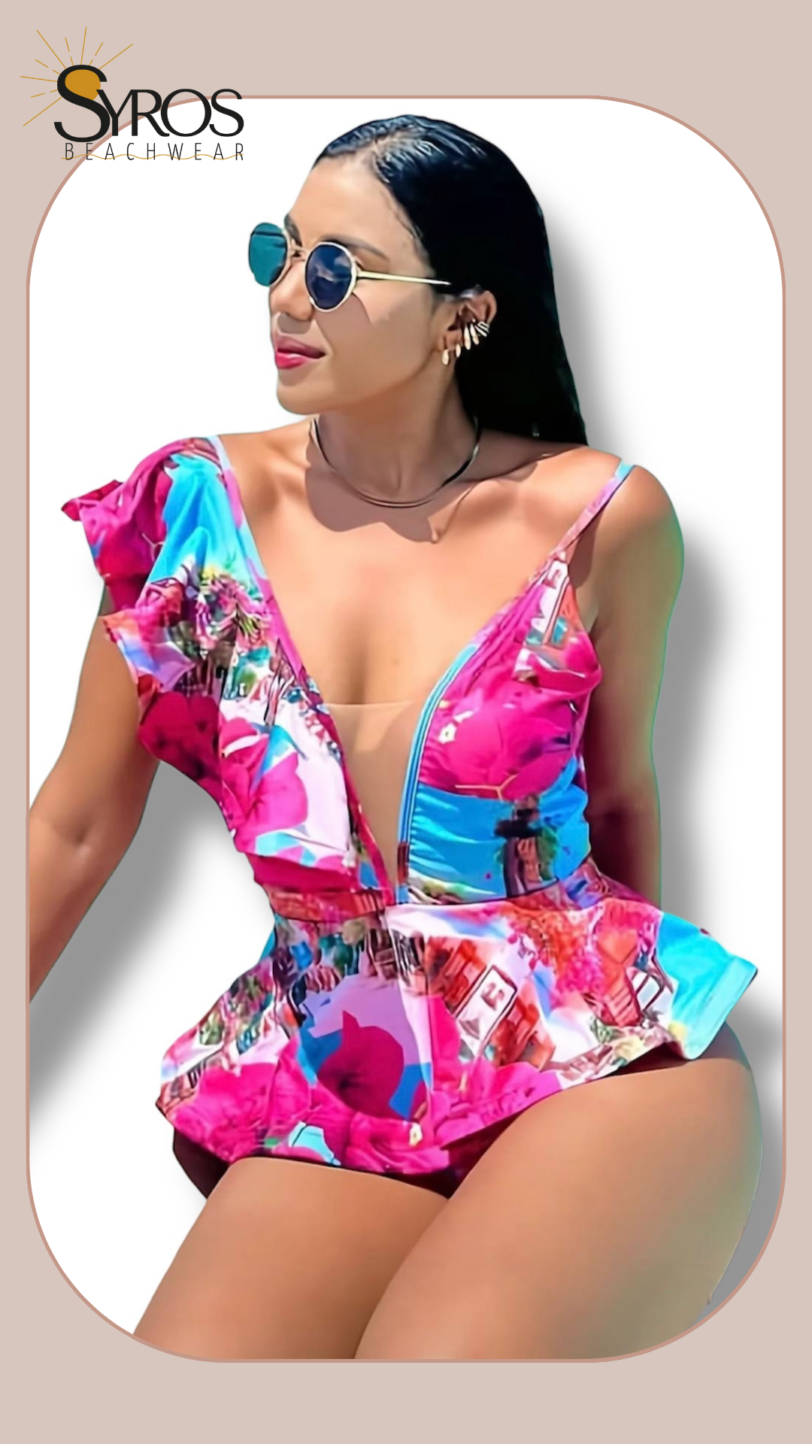 Enterizo estampado fucsia con faralao en manga y volante en abdomen